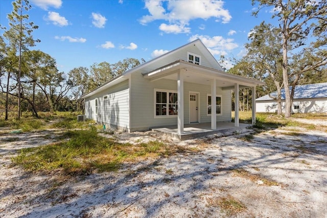 view of front of property featuring central air condition unit and a porch