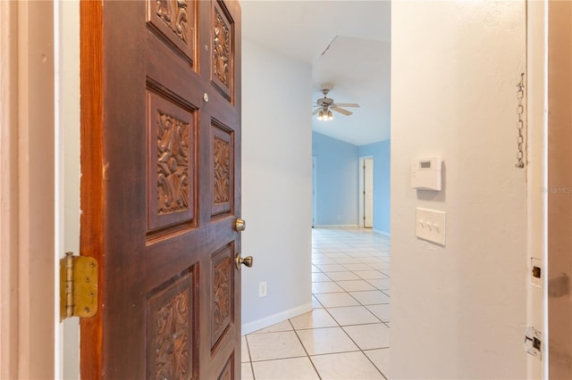 hallway with light tile patterned floors