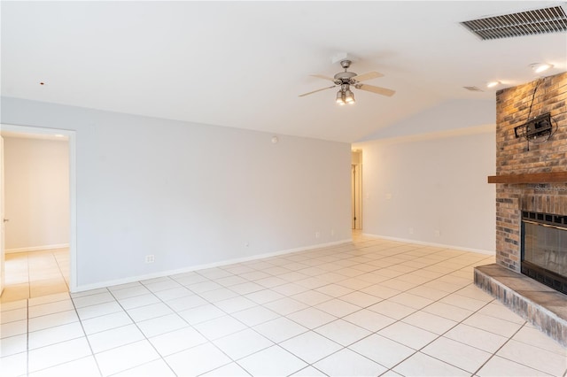 unfurnished living room featuring ceiling fan, lofted ceiling, light tile patterned floors, and a fireplace