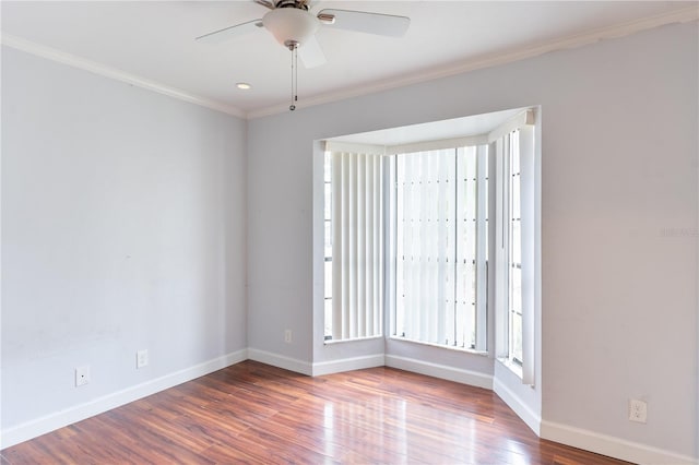 spare room featuring crown molding, hardwood / wood-style floors, and ceiling fan