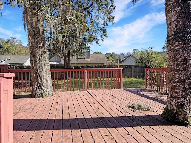 wooden deck with a yard