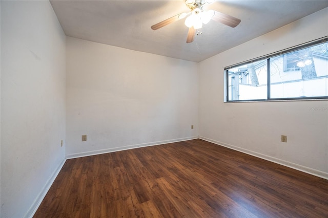 unfurnished room featuring ceiling fan and dark hardwood / wood-style flooring