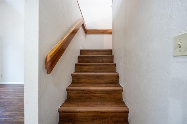 stairs with hardwood / wood-style floors