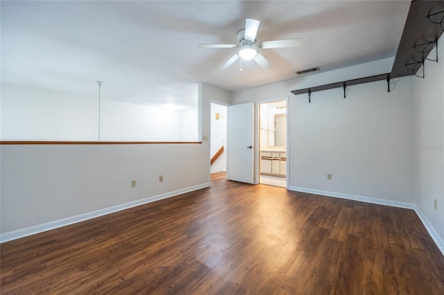 spare room with ceiling fan and dark hardwood / wood-style floors