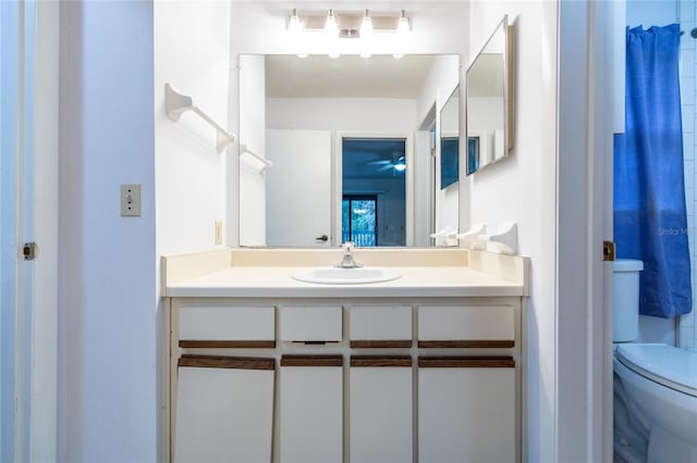 bathroom featuring vanity and toilet