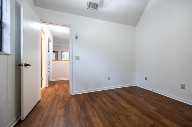 unfurnished room featuring dark hardwood / wood-style flooring