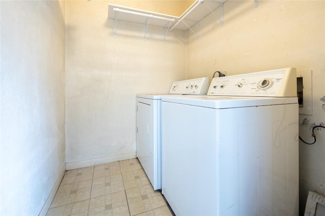 clothes washing area with washing machine and clothes dryer