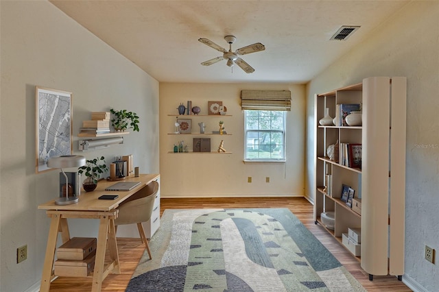 office area with ceiling fan and light wood-type flooring