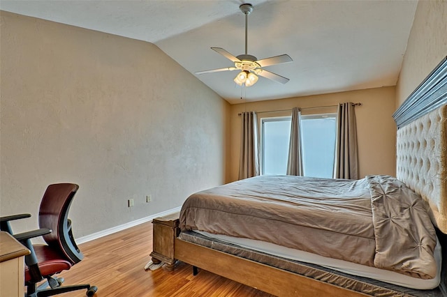 bedroom featuring wood-type flooring, ceiling fan, and lofted ceiling