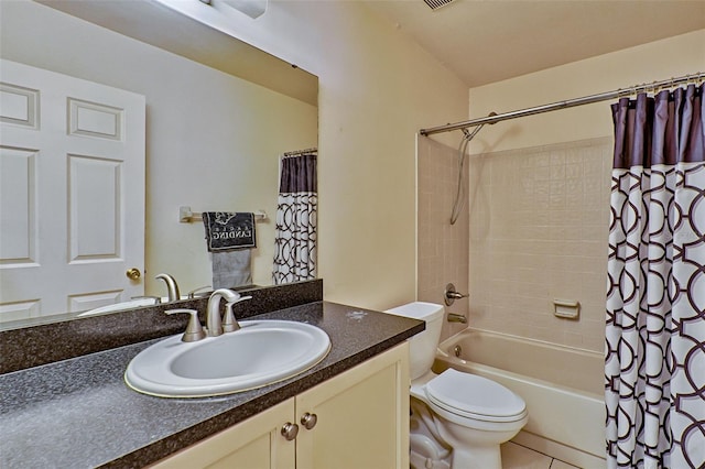 full bathroom featuring tile patterned flooring, shower / bath combo, vanity, and toilet