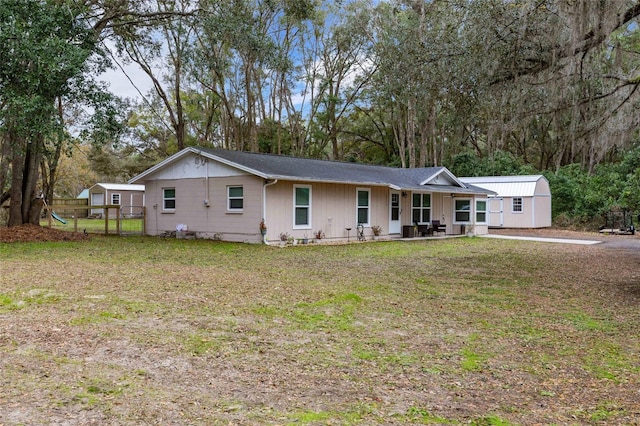 ranch-style house featuring a porch and a front lawn