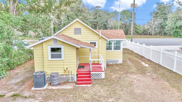 back of property featuring central air condition unit