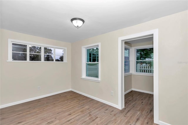 unfurnished room featuring light wood-type flooring