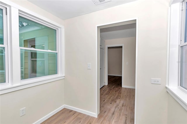 hall with light hardwood / wood-style flooring