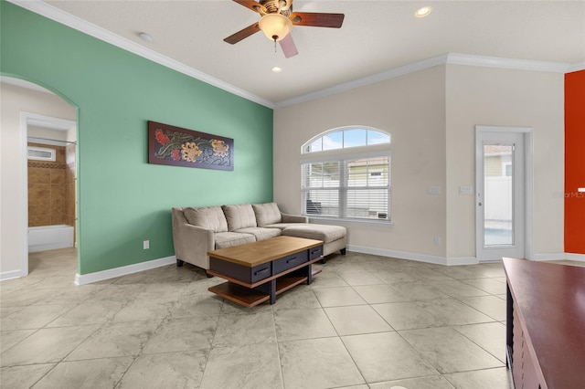 living room with ceiling fan, a wealth of natural light, and crown molding