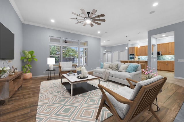 living room with light wood-type flooring and crown molding