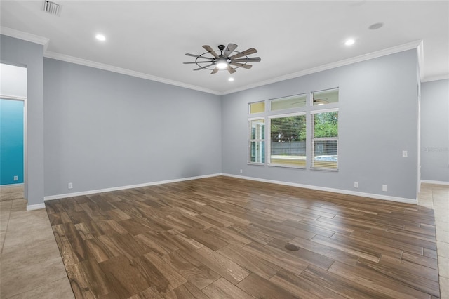 spare room with ornamental molding, ceiling fan, and wood-type flooring