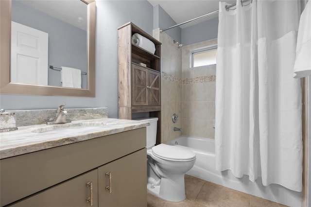 full bathroom featuring tile patterned flooring, shower / tub combo with curtain, vanity, and toilet