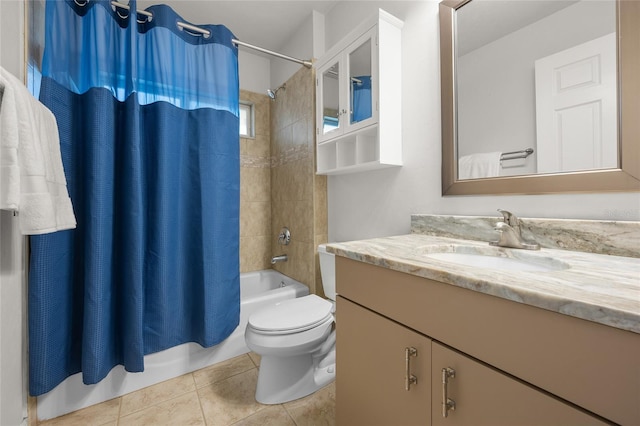 full bathroom with toilet, shower / bath combo with shower curtain, tile patterned floors, and vanity