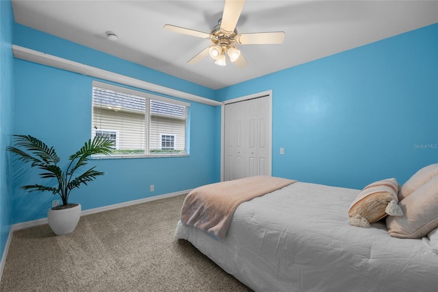 bedroom featuring ceiling fan, a closet, and carpet