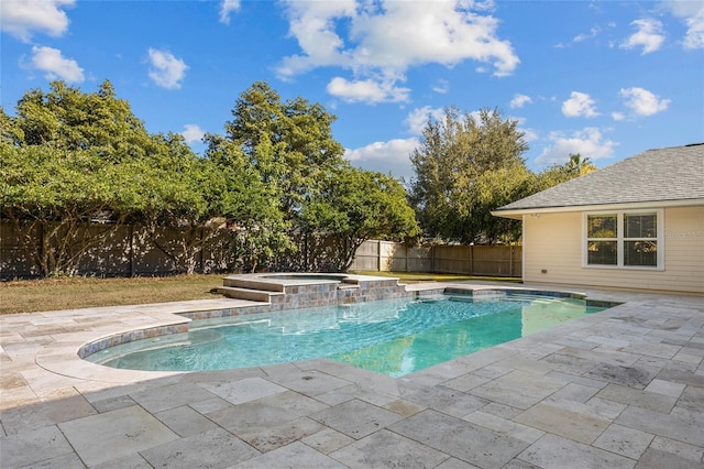 view of swimming pool featuring an in ground hot tub and a patio area