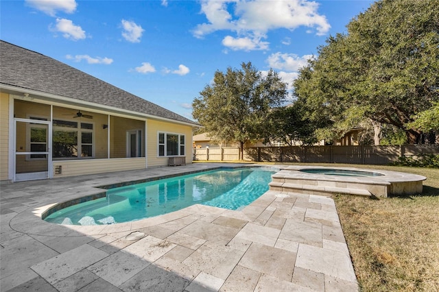 view of pool featuring a patio area, ceiling fan, and an in ground hot tub