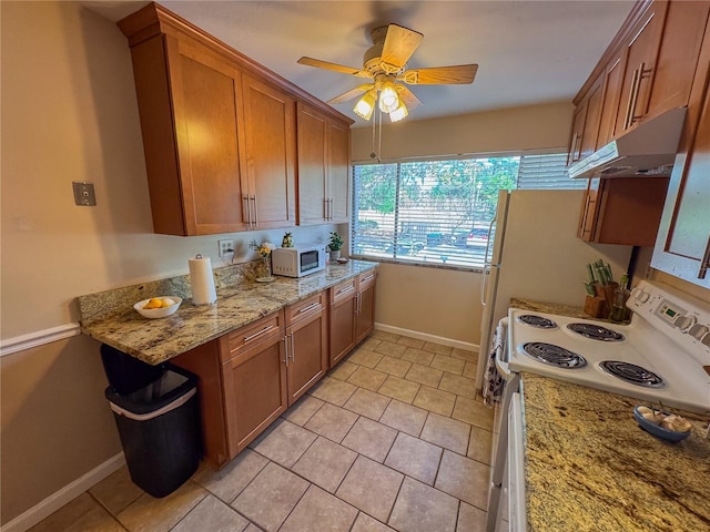 kitchen featuring ceiling fan, light tile patterned floors, light stone counters, and electric stove