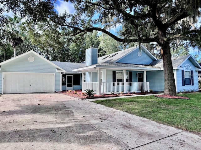 ranch-style house with a porch, a front lawn, and a garage