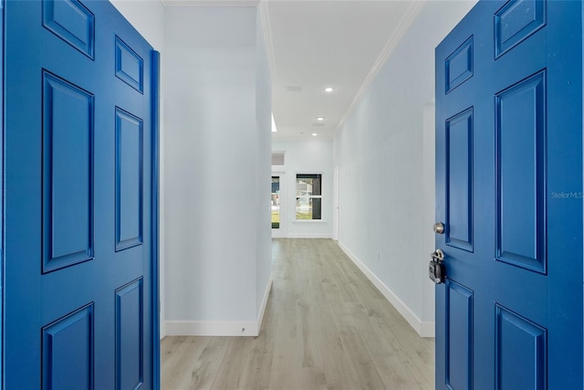 entrance foyer featuring baseboards, light wood finished floors, recessed lighting, and crown molding