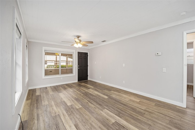 spare room featuring ceiling fan, ornamental molding, and hardwood / wood-style floors