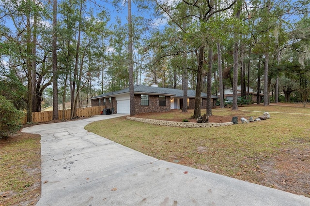 single story home with a front yard and a garage