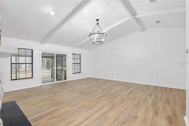 unfurnished living room featuring light hardwood / wood-style floors, a notable chandelier, and lofted ceiling with beams