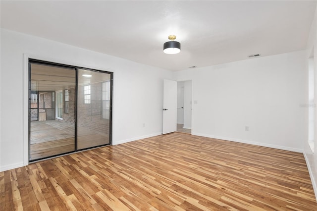 unfurnished room featuring light hardwood / wood-style flooring