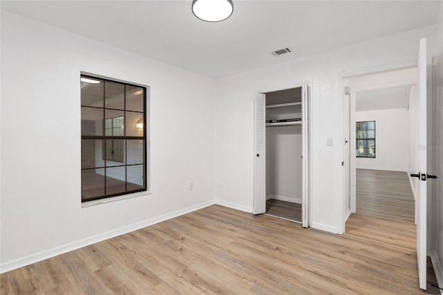 unfurnished bedroom with light hardwood / wood-style flooring