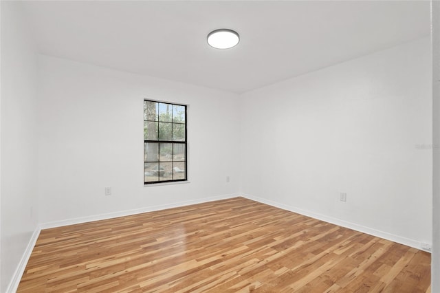 spare room featuring light wood-type flooring