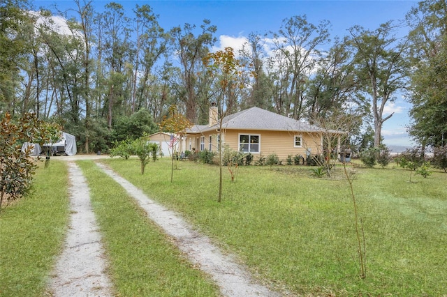 view of yard featuring a garage