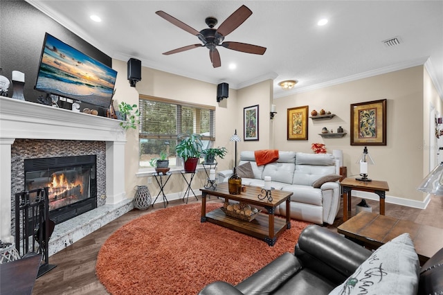 living room featuring ceiling fan, dark hardwood / wood-style flooring, and crown molding