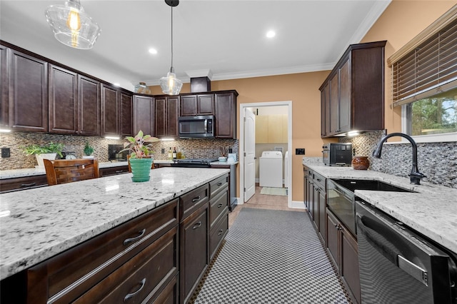 kitchen featuring sink, hanging light fixtures, dishwasher, and dark brown cabinetry