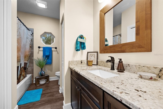 full bathroom featuring toilet, vanity, shower / bath combo, and hardwood / wood-style flooring