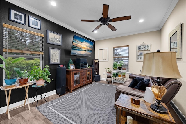 living room featuring ornamental molding, ceiling fan, and hardwood / wood-style floors