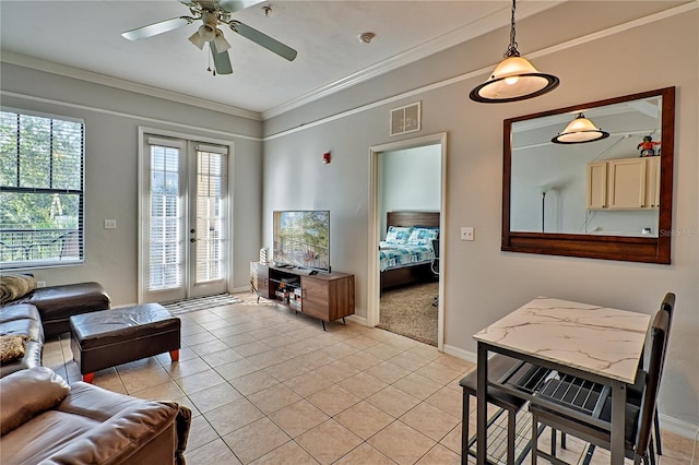 living room with ceiling fan, light tile patterned flooring, french doors, and crown molding