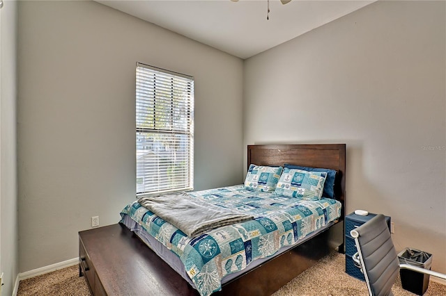 bedroom with ceiling fan and carpet flooring