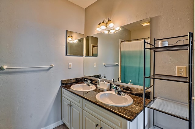 bathroom featuring curtained shower and vanity