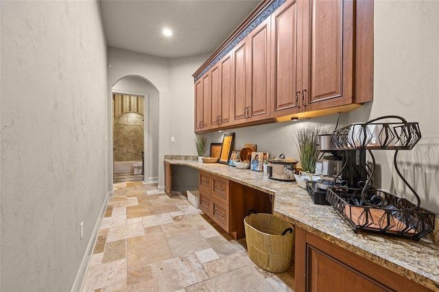 kitchen with light stone countertops