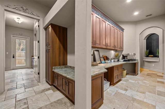 kitchen featuring light stone counters