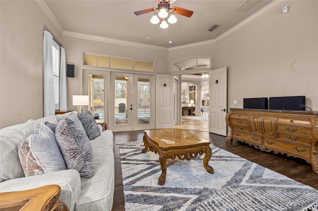 living room featuring ceiling fan, dark hardwood / wood-style flooring, and ornamental molding