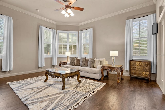 sitting room with dark wood-type flooring, ceiling fan, and a healthy amount of sunlight