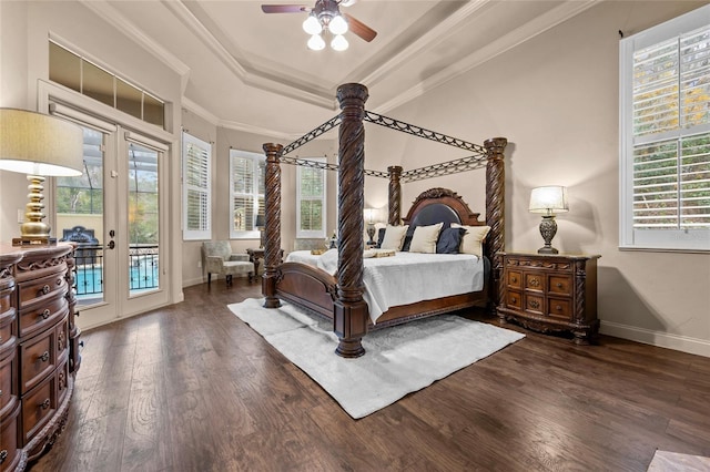 bedroom featuring dark hardwood / wood-style floors, a raised ceiling, french doors, ornamental molding, and access to exterior