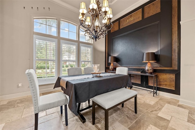 dining area featuring ornamental molding, a wealth of natural light, and a chandelier