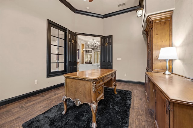 office space featuring an inviting chandelier, ornamental molding, and dark wood-type flooring